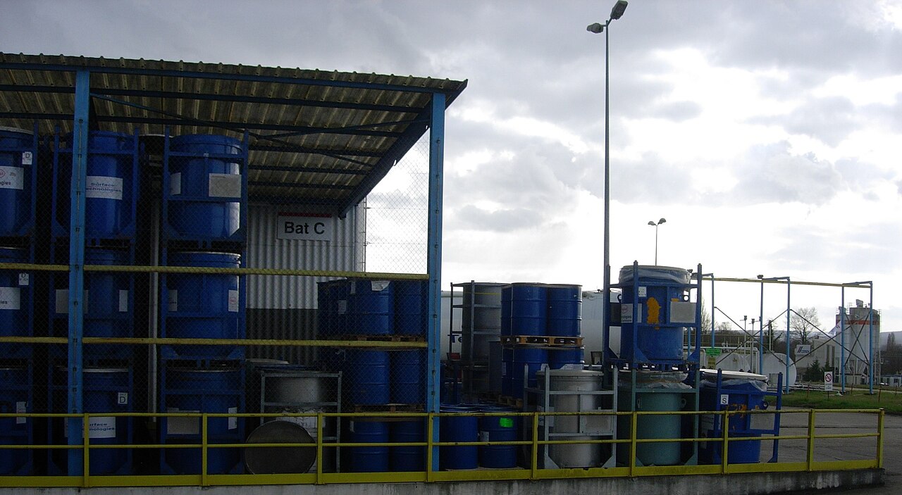 Industrial chemical drums at a storage site