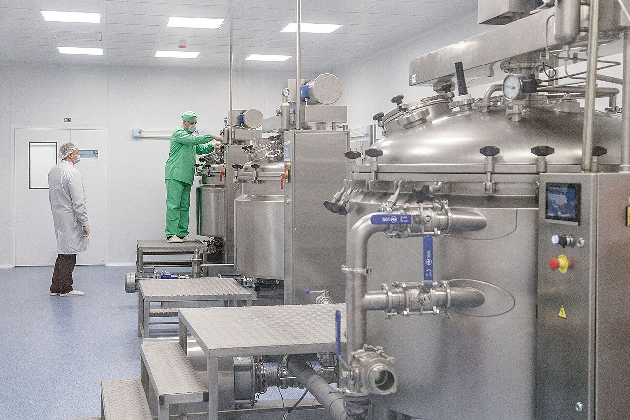 Pharmaceutical production line inside a manufacturing plant